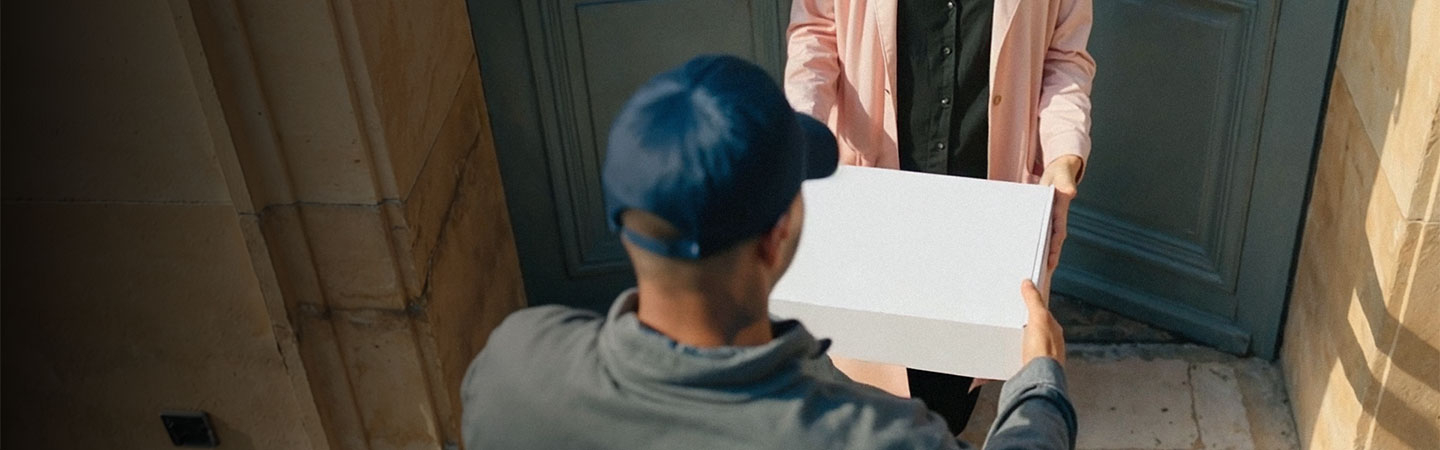 Man handing package to a person